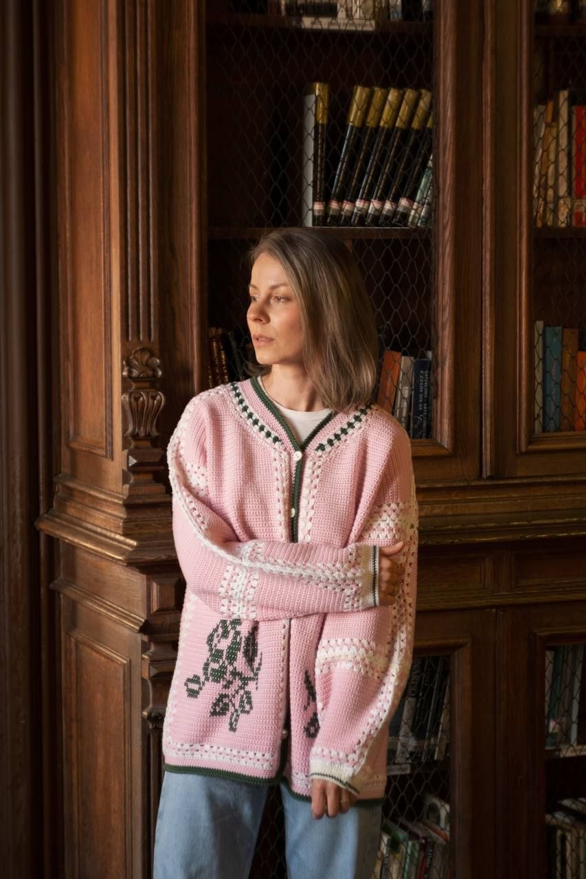 Uliana Sitnik wearing one of her own handmade crochet cardigans